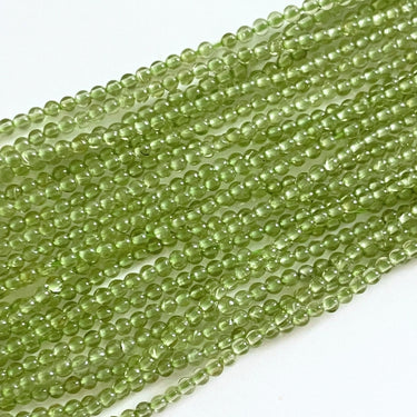 Runde Peridot perler 2 mm – ca. 195 stk. på streng i klar grøn nuance