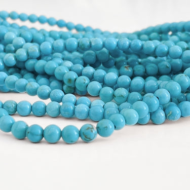 Turkis magnesite perler – 4 mm, blå med årer
