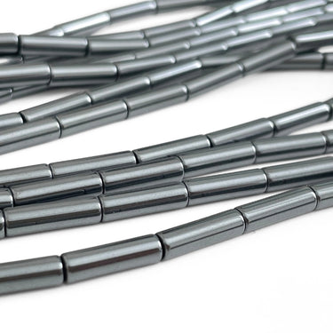 Lange hæmatit rørperler 4x13 mm i blank metalgrå