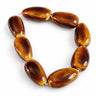8 brune dråbeformede porcelænsperler, ca. 27 x 15 mm