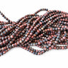 4 mm rød leopardskindsjaspis i en bunke