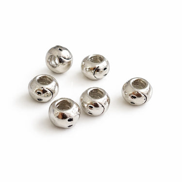 sølvfarvede spacerperler med indgraveret smiley