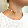 Halskæde "choker" i perler med guld perle sløjfe.