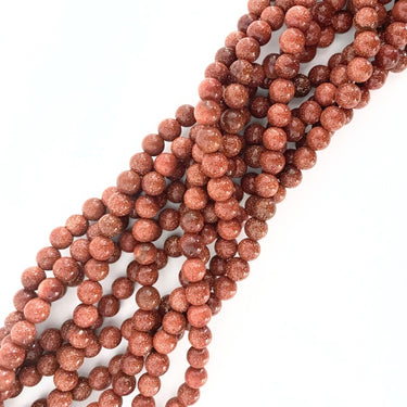 6 mm Goldstone perler - Hel streng