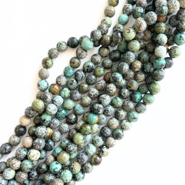 Afrikansk turkis, facet 8 mm - Hel streng