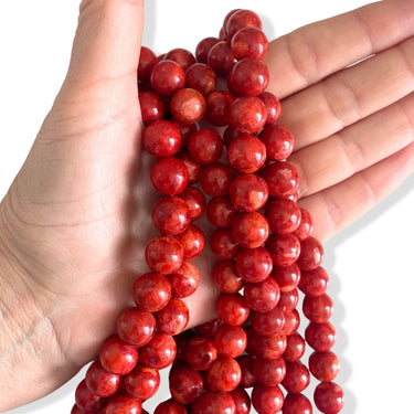 Orangerøde skumkoralperler 12 mm – ca. 36 stk. på hel streng