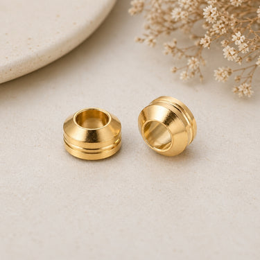 rillet perle i guldfarvet rustfri stål 11 mm