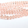 rosa facetskårne glasperler