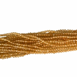 Små fine ca. 2,5 mm facetterede citrin perler. Strengen måler 20 cm. i længden