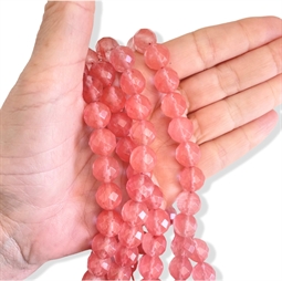 Streng med runde, farvede mashan jadeperler i varm rosa nuance