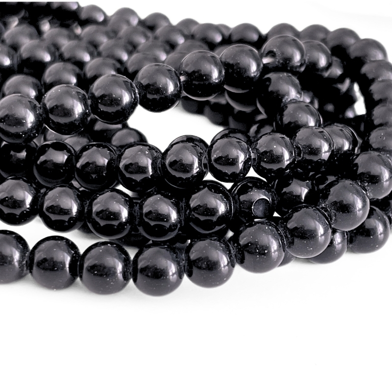 6 mm onyx perler i ensfarvet sort – glatte, blanke og velegnet til armbånd og øreringe
