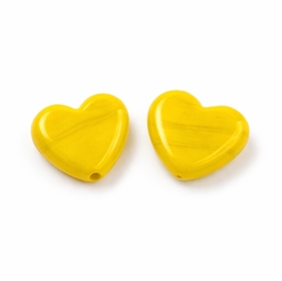 Gule hjerteperler i glas med lodret hul